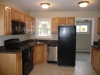 Kitchen showing door to laundry